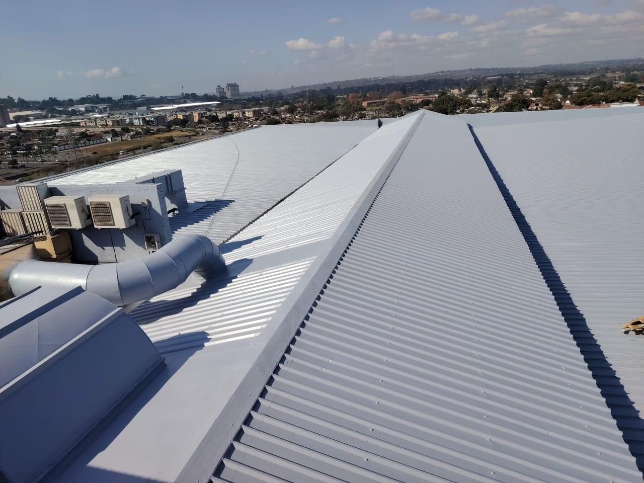 ERI skilled team applying rubber coating on roof